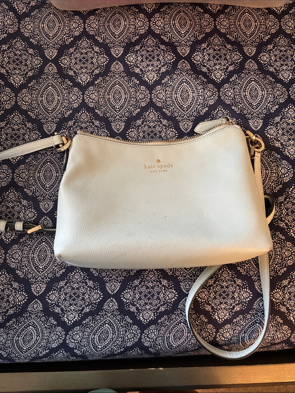 kate spade cream pebble leather crossbody with gold-tone hardware